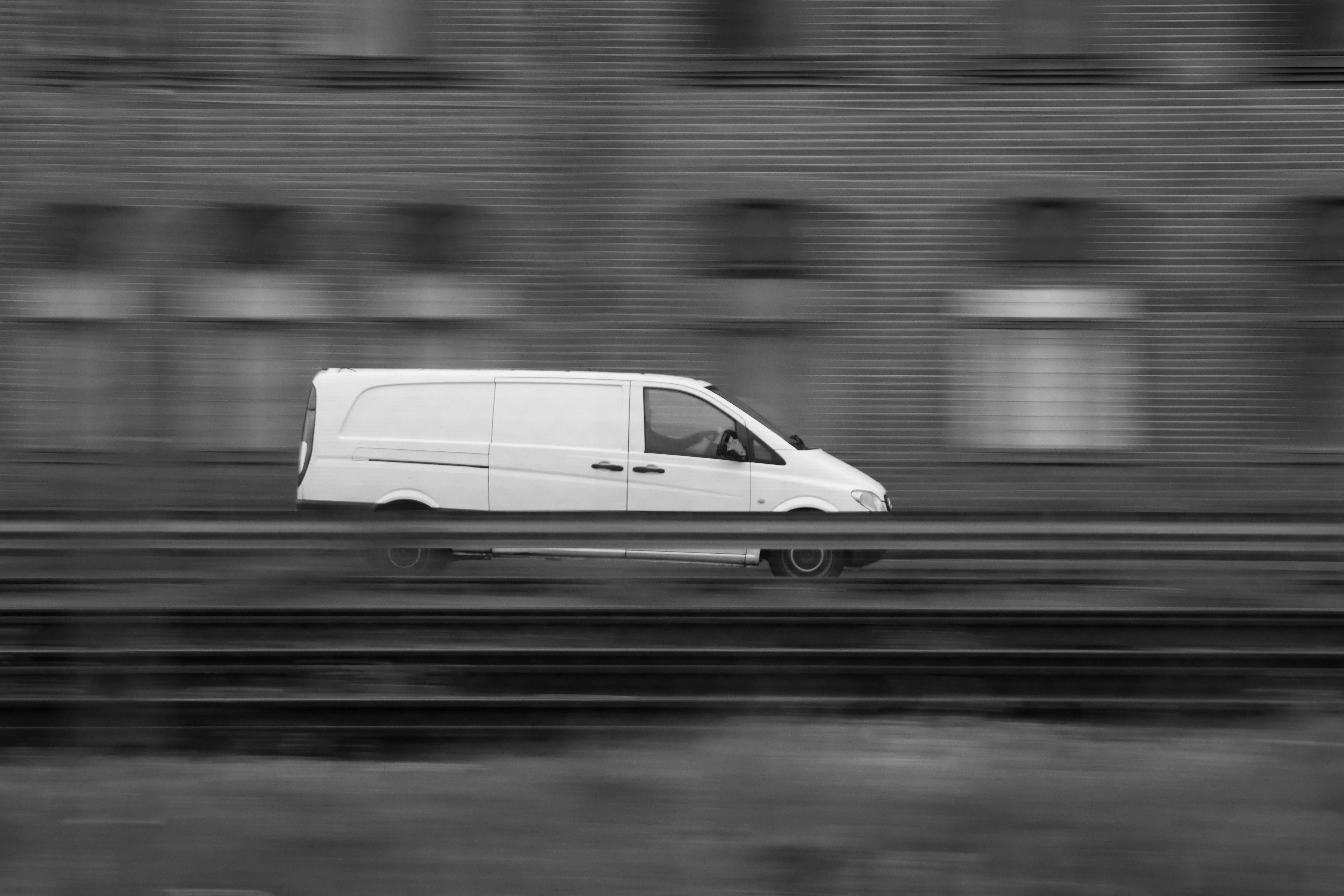 A delivery van in motion, panning shot