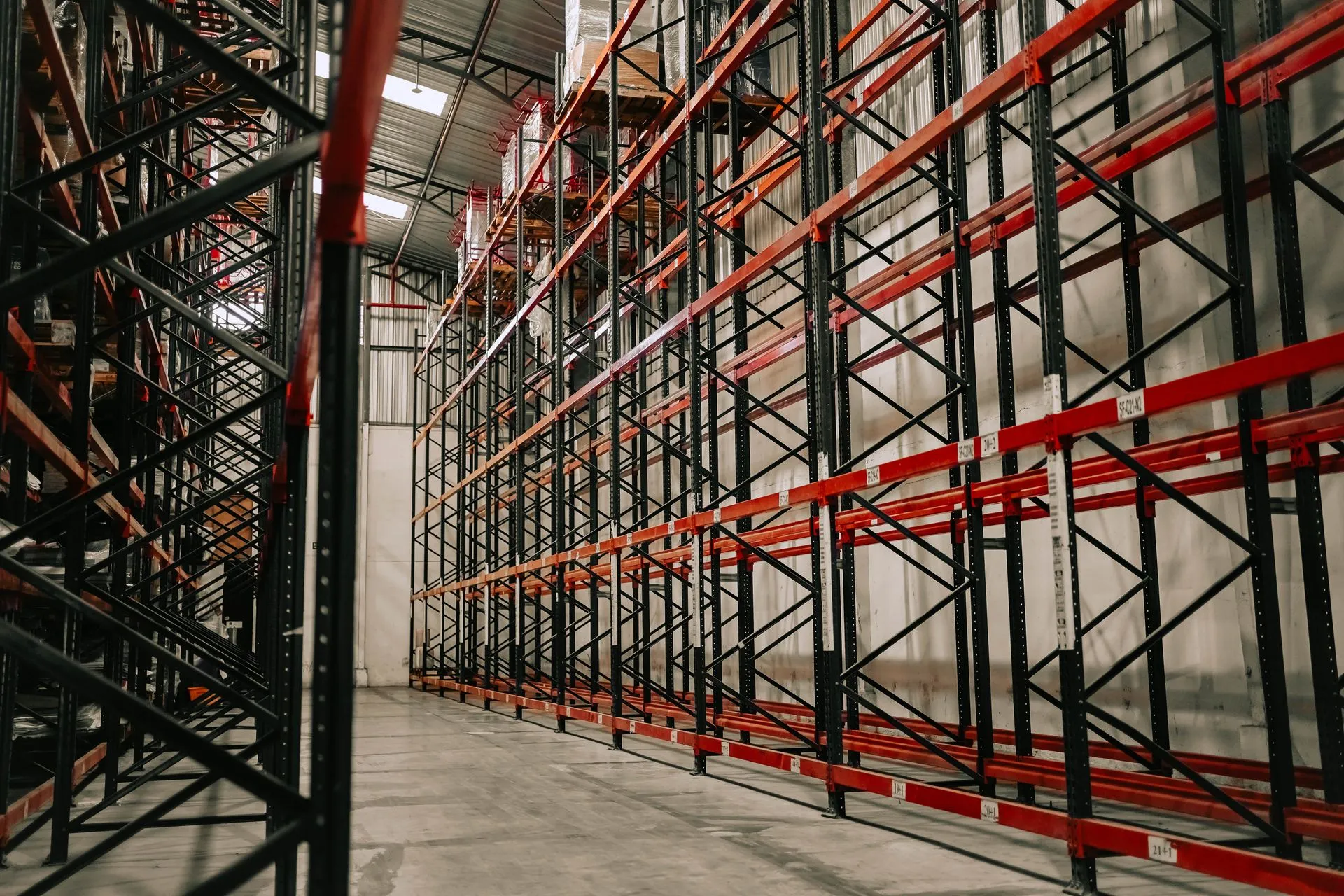 Empty pallet racking aisle in a modern warehouse