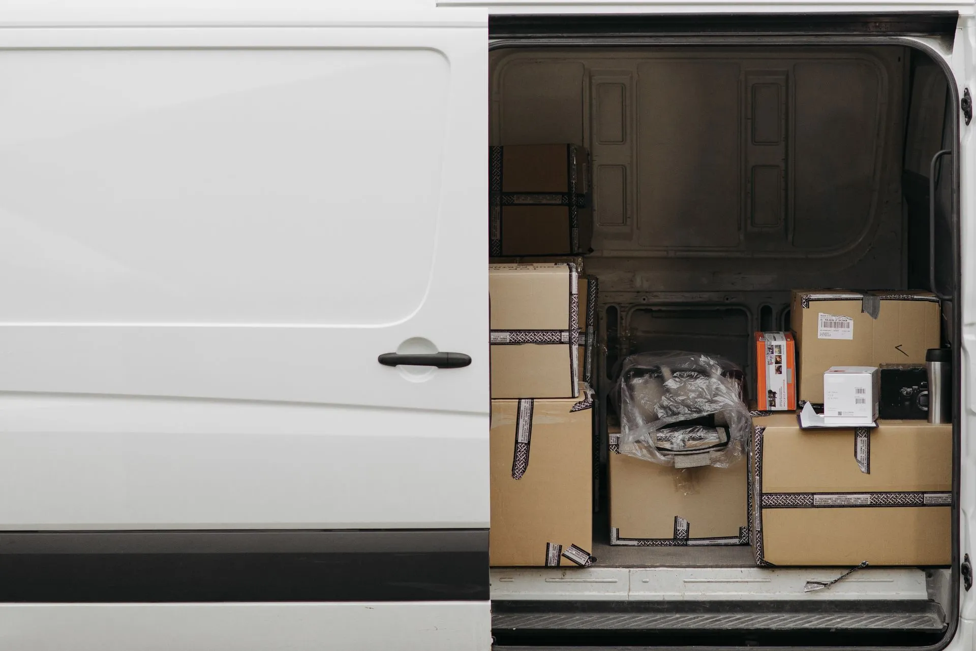 Loaded panel van with boxes secured in the load area